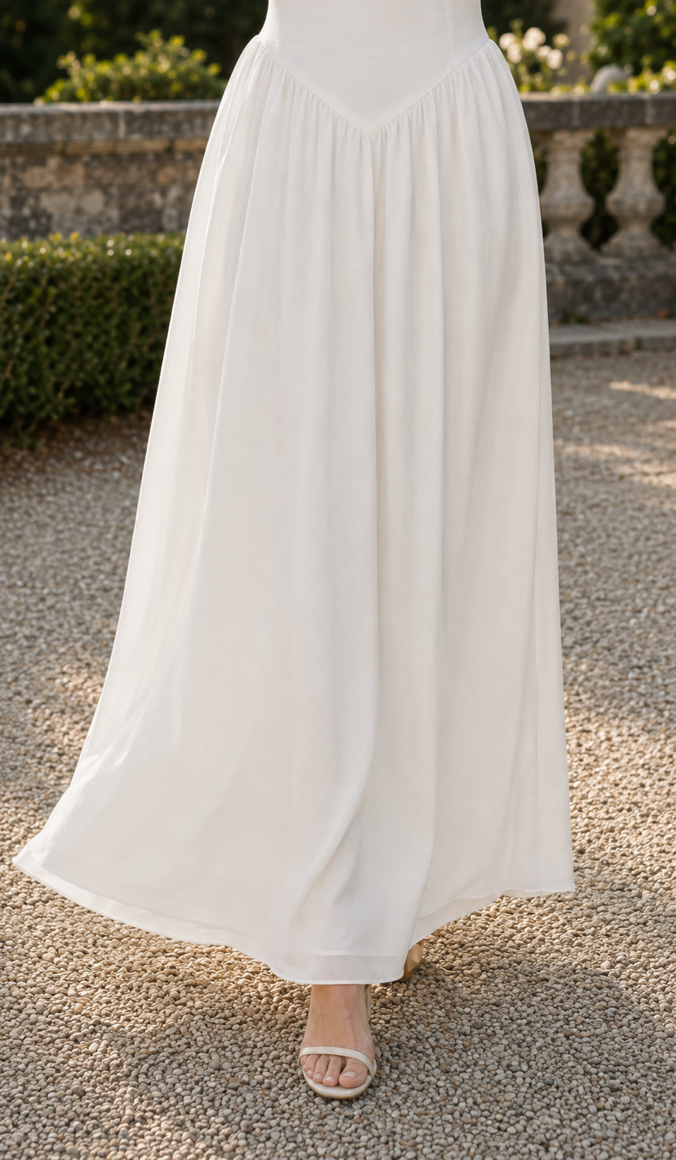 Close-up of the pointed waist and softly gathered flowing skirt of A Minuet at Versailles Dress.
