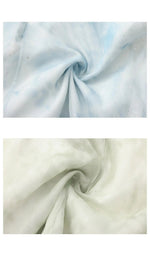 Close-up of the lightweight chiffon fabric used for the blue and green halter dresses, featuring a soft watercolor texture and subtle shimmer.
