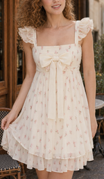 Close-up front view of the Café Rosalie Dress with a square neckline, flutter sleeves and centered ivory bow.