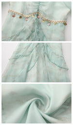 Close-up details of the Celestine’s Waltz dress showing charm trim, layered ruffles and lightweight mint chiffon