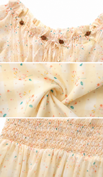 Close-up details of the Daisies After The Rain Corset Dress showcasing the delicate floral print, ruffle neckline, decorative rose accents, and smocked bodice.
