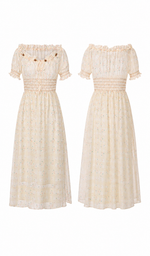 Front and back view of the Daisies After The Rain Corset Dress displaying the romantic floral print, elastic smocked waist, puff sleeves, and flowing midi skirt.