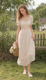 Model twirling in the Daisies After The Rain Corset Dress, showcasing the lightweight floral fabric, elegant drape, and romantic countryside style.
