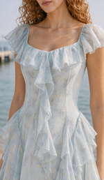 Close-up of the Echoes of Tsingtao Bay Dress square neckline, flutter sleeves, floral print and gold accents.