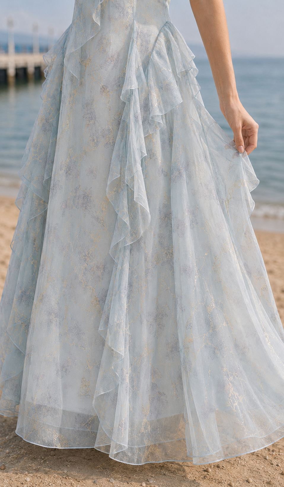 Close-up of the Echoes of Tsingtao Bay Dress layered chiffon skirt, side ruffles and metallic gold floral print.