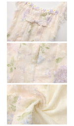 Close-up details of the Hydrangeas After Sunset Corset Dress featuring textured floral lace overlay, pastel hydrangea print, decorative ribbon bow, and premium romantic craftsmanship.