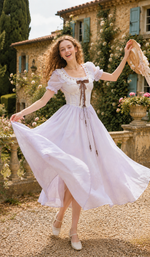 Model dancing in the Letters From Villa Fiora Corset Dress, featuring delicate lace trim, puff sleeves, flowing chiffon fabric, and graceful movement.