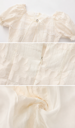 Close-up details of the Morning in Annecy Corset Dress showcasing the bow, floral jacquard texture, zipper, and lightweight layered fabric.