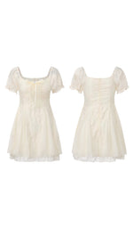 Front and back views of the ivory Morning in Annecy Corset Dress (Short) on a white background