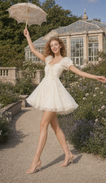 Model wearing the Morning in Annecy Corset Dress (Short) with a lace parasol in a botanical garden