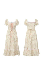 Front and back view of the Roses After Sunday Corset Dress featuring a floral print, lace-up corset bodice, puff sleeves, adjustable waist tie, and flowing midi skirt.
