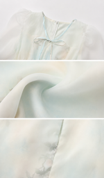 Fabric and construction details of the Sea Glass Memory Corset Dress showcasing the lightweight chiffon texture, subtle floral print, and elegant craftsmanship.