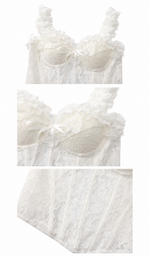 Close-up details of the The Forgotten Bride Corset highlighting the floral lace texture, delicate ribbon bow, supportive boning, and premium craftsmanship.
