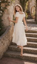 The Last Promise of Ravello ivory midi dress styled on sunlit stone garden steps