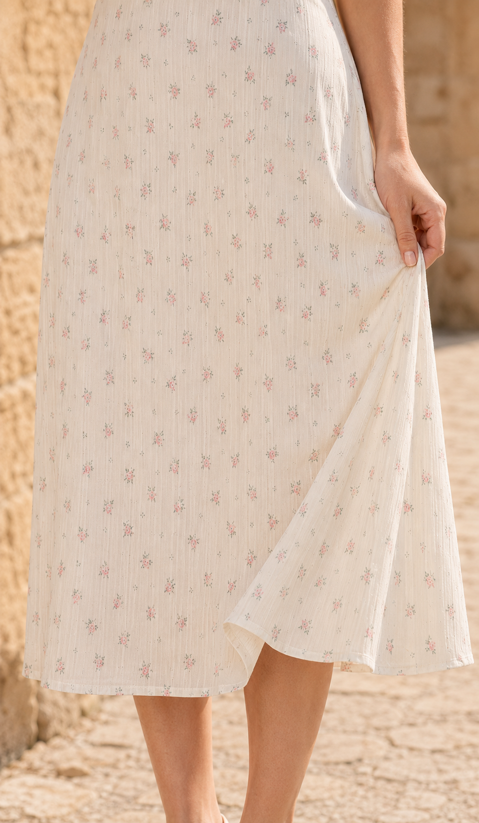 Close-up of the flowing floral skirt, vertical fabric texture and finished hem of The Rosekeeper of Gordes Dress.