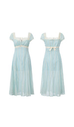 Front and back view of The Seventh Letter Corset Dress featuring soft blue embroidered fabric, lace trim, puff sleeves, ribbon waist tie, and an elegant flowing midi silhouette.